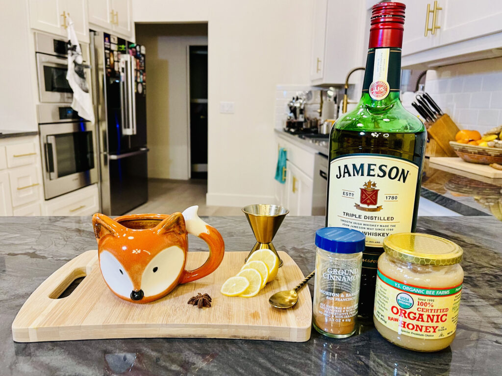 The ingredients for a hot toddy are pretty simple just whiskey or rum or brandy, lemon juice, and honey